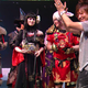 Yoshida (right) asks Yotsuyu cosplayer (in black) to “step on me, please.”
